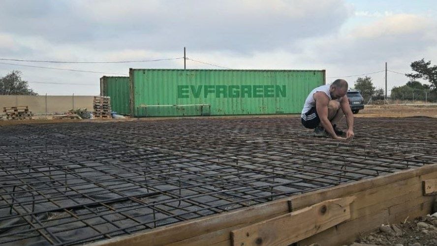 Founder tying rebar on a construction site